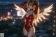 A woman in a red bodysuit with angel wings standing on top of a building.